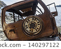 Burned SUV Wreck After Falling from Cliff. 140297122