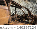 Burned SUV Wreck After Falling from Cliff. 140297124