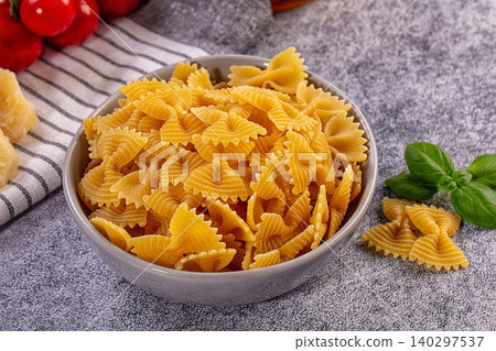 Golden Farfalle Pasta, Red Tomatoes, Green Basil, Parmesan Cheese Golden Farfalle Pasta, Red Tomatoes, Green Basil, Parmesan Cheese 140297537