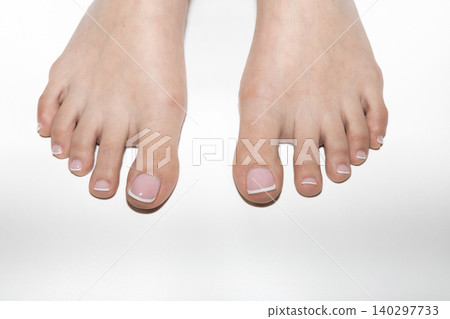 Female feet with neat pedicure and copyspace 140297733
