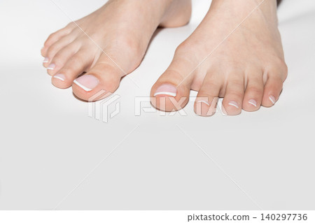 Female feet with neat pedicure and copyspace 140297736