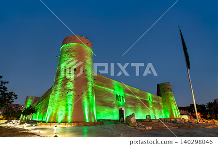Masmak Fort illuminated with green lights at night in Riyadh Masmak Fort illuminated with green lights at night in Riyadh 140298046