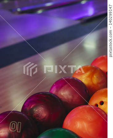 Bowling club play, group team of friends and colleagues playing, throwing a ball on the bowling alley lane, ball and pins, corporate party event in a mall amusement game center, tournament competition Bowling club play, group team of friends and colleagues playing, throwing a ball on the bowling alley lane, ball and pins, corporate party event in a mall amusement game center, tournament competition 140299147