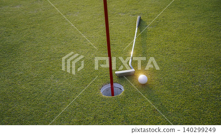Top view. Golf golf ball near hole on a green grass in the evening golf course. 140299249