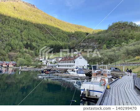 Flåm, Norway: A beautiful marina and harbor scenery facing the fjords. Flåm, Norway: A beautiful marina and harbor scenery facing the fjords. 140299470