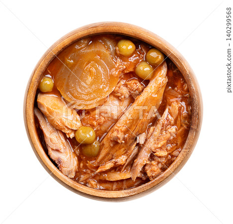 Canned tuna pieces in piquant sauce with vegetables in a wooden bowl. Chunks of skipjack tuna, Katsuwonus pelamis, in light tomato sauce with an onion slice and green peas. Isolated, from above. Photo Canned tuna pieces in piquant sauce with vegetables in a wooden bowl. Chunks of skipjack tuna, Katsuwonus pelamis, in light tomato sauce with an onion slice and green peas. Isolated, from above. Photo 140299568