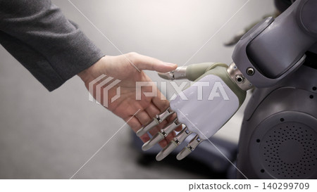 AI Robot shaking hands with man. Close up of human shaking hand with robotic arm. Symbolizing collaborate between people and artificial intelligence or AI. Automation robot innovate future technology AI Robot shaking hands with man. Close up of human shaking hand with robotic arm. Symbolizing collaborate between people and artificial intelligence or AI. Automation robot innovate future technology 140299709