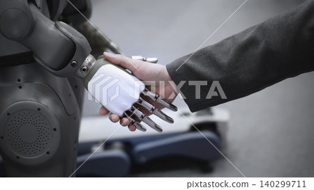 AI Robot shaking hands with man. Close up of human shaking hand with robotic arm. Symbolizing collaborate between people and artificial intelligence or AI. Automation robot innovate future technology AI Robot shaking hands with man. Close up of human shaking hand with robotic arm. Symbolizing collaborate between people and artificial intelligence or AI. Automation robot innovate future technology 140299711