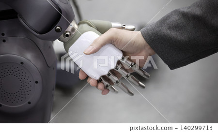 AI Robot shaking hands with man. Close up of human shaking hand with robotic arm. Symbolizing collaborate between people and artificial intelligence or AI. Automation robot innovate future technology AI Robot shaking hands with man. Close up of human shaking hand with robotic arm. Symbolizing collaborate between people and artificial intelligence or AI. Automation robot innovate future technology 140299713