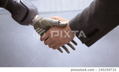 AI Robot shaking hands with man. Close up of human shaking hand with robotic arm. Symbolizing collaborate between people and artificial intelligence or AI. Automation robot innovate future technology AI Robot shaking hands with man. Close up of human shaking hand with robotic arm. Symbolizing collaborate between people and artificial intelligence or AI. Automation robot innovate future technology 140299718