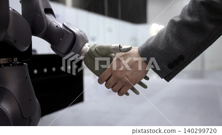 AI Robot shaking hands with man. Close up of human shaking hand with robotic arm. Symbolizing collaborate between people and artificial intelligence or AI. Automation robot innovate future technology AI Robot shaking hands with man. Close up of human shaking hand with robotic arm. Symbolizing collaborate between people and artificial intelligence or AI. Automation robot innovate future technology 140299720