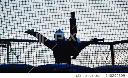 Person experiencing bodyflight in an indoor wind tunnel, practicing extreme sport Person experiencing bodyflight in an indoor wind tunnel, practicing extreme sport 140299809