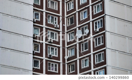 Moscow soviet brutalist architecture apartment facade with windows and satellite dishes Moscow soviet brutalist architecture apartment facade with windows and satellite dishes 140299860
