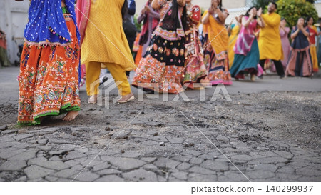 People dancing in traditional Indian clothing celebrating Ganesh Chaturthi festival People dancing in traditional Indian clothing celebrating Ganesh Chaturthi festival 140299937
