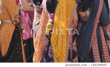 Indian women wearing colorful traditional clothing during Ganesha festival in India Indian women wearing colorful traditional clothing during Ganesha festival in India 140299947