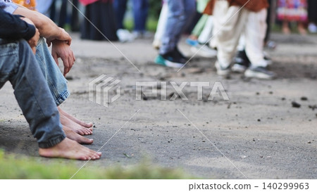 Devotees sitting barefoot at Ganesh Chaturthi festival, participating in traditions Devotees sitting barefoot at Ganesh Chaturthi festival, participating in traditions 140299963