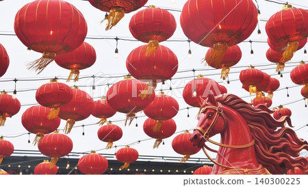Chinese New Year celebration with red lanterns and a horse statue Chinese New Year celebration with red lanterns and a horse statue 140300225