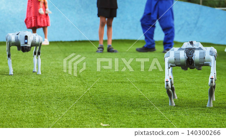 Robot dogs interacting with people on artificial grass, symbolizing future technology Robot dogs interacting with people on artificial grass, symbolizing future technology 140300266