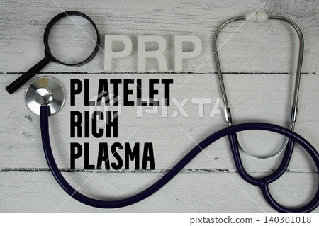 PRP Platelet-Rich Plasma text with Stethoscope on wooden background PRP Platelet-Rich Plasma text with Stethoscope on wooden background 140301018