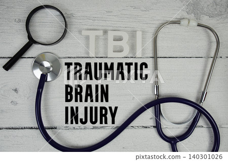 TBI Traumatic Brain Injury text with Stethoscope on wooden background TBI Traumatic Brain Injury text with Stethoscope on wooden background 140301026