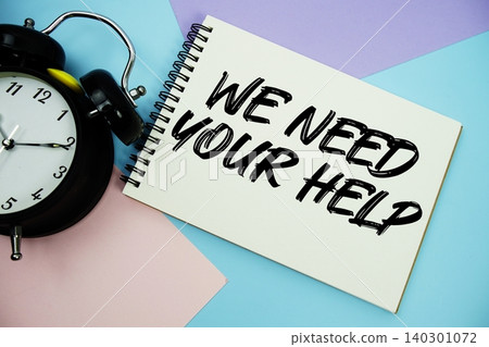 We Need Your Help text written on notepad with alarm clock flat lay on multicolor pastel background We Need Your Help text written on notepad with alarm clock flat lay on multicolor pastel background 140301072