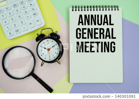 Annual General Meeting text with calculator, alarm clock and magnifying glass Annual General Meeting text with calculator, alarm clock and magnifying glass 140301091