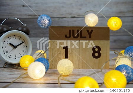 Wooden Calendar Showing the Date of July 18th. Day 18 of July month Wooden Calendar Showing the Date of July 18th. Day 18 of July month 140301170
