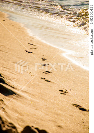 Human footprints on yellow sand beach water pond sea ocean, summer landscape Human footprints on yellow sand beach water pond sea ocean, summer landscape 140301432