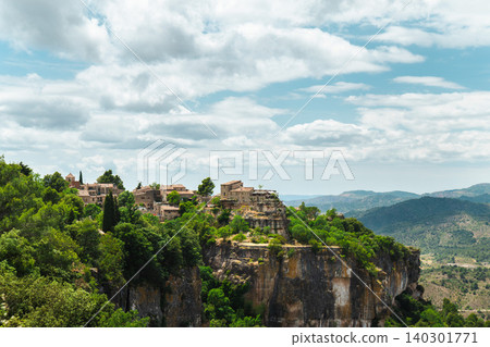 Siurana cliffside village overlooking rugged canyon and mountain landscape in Catalonia, Spain Siurana cliffside village overlooking rugged canyon and mountain landscape in Catalonia, Spain 140301771