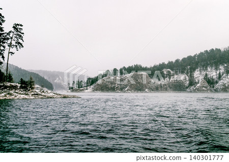 Krasnoyarsk Reservoir on Yenisei River, winter landscape on cloudy day Siberia Krasnoyarsk Reservoir on Yenisei River, winter landscape on cloudy day Siberia 140301777