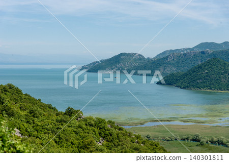 Skadar Lake in Montenegro, summer scenic waterscape pond on sunny day nature Skadar Lake in Montenegro, summer scenic waterscape pond on sunny day nature 140301811