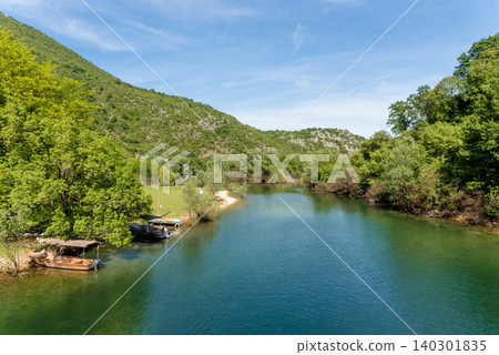 Crnojevica River flows into Lake Skadar, summer mountains Montenegro landscape 140301835