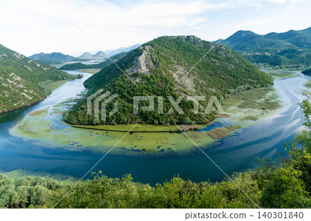 Crnojevica River flows into Lake Skadar, summer mountains Montenegro landscape 140301840