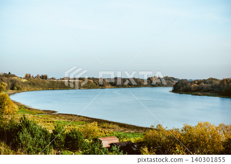 Wide river flows in valley plain on sunny summer day in central Russia Wide river flows in valley plain on sunny summer day in central Russia 140301855