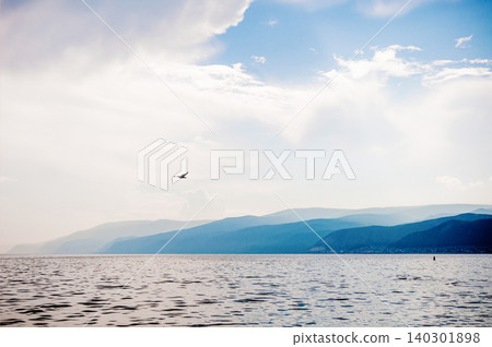 Landscape of blue deep lake sun day summer, clouds sky, Baikal Siberia Russia Landscape of blue deep lake sun day summer, clouds sky, Baikal Siberia Russia 140301898