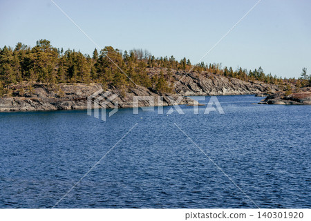 Landscape blue deep lake light sun, clouds sky mountains Ladoga skerries Karelia Landscape blue deep lake light sun, clouds sky mountains Ladoga skerries Karelia 140301920