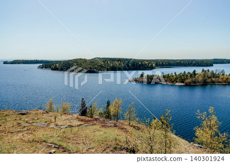 Landscape blue deep lake light sun, clouds sky mountains Ladoga skerries Karelia Landscape blue deep lake light sun, clouds sky mountains Ladoga skerries Karelia 140301924