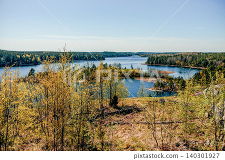 Landscape blue deep lake light sun, clouds sky mountains Ladoga skerries Karelia Landscape blue deep lake light sun, clouds sky mountains Ladoga skerries Karelia 140301927