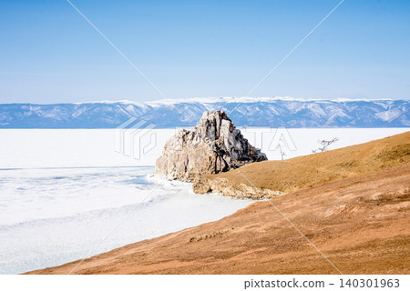 Shaman Rock on Lake Baikal Siberia Russia, winter landscape of frozen ice pond 140301963