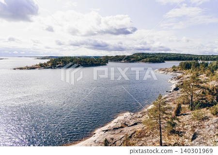 Landscape blue deep lake light sun, clouds sky mountains Ladoga skerries Karelia Landscape blue deep lake light sun, clouds sky mountains Ladoga skerries Karelia 140301969