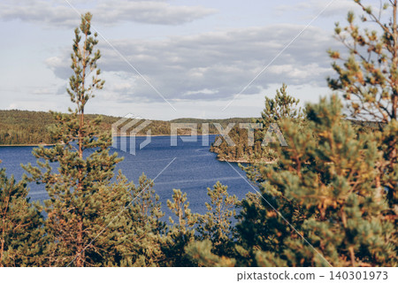 Landscape blue deep lake light sun, clouds sky mountains Ladoga skerries Karelia Landscape blue deep lake light sun, clouds sky mountains Ladoga skerries Karelia 140301973