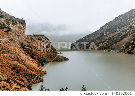 Reservoir, lake in Caucasus Dagestan Russia, summer mountain landscape scenery Reservoir, lake in Caucasus Dagestan Russia, summer mountain landscape scenery 140302001