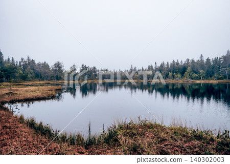 Lake on top of Mount Vottovaara in Karelia Russia, summer landscape cloudy day 140302003