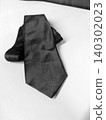 Black tie on the table 140302023