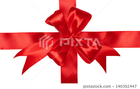 A bright red satin ribbon with a fluffy bow in the center, tied crosswise on an isolated background. A bright red satin ribbon with a fluffy bow in the center, tied crosswise on an isolated background. 140302447