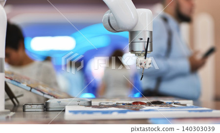 Robotic arm with a paintbrush creating art, showcasing AI creativity and future technology Robotic arm with a paintbrush creating art, showcasing AI creativity and future technology 140303039