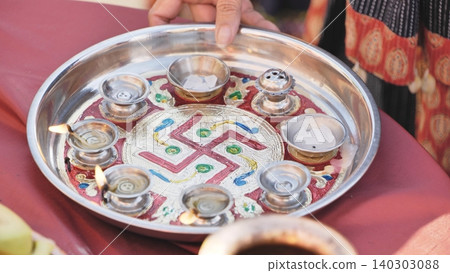 Puja thali with Ganesha festival offerings, a symbolic Hindu ritual in India Puja thali with Ganesha festival offerings, a symbolic Hindu ritual in India 140303088