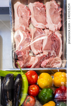 tray of pork chops and local vegetables in Armenia tray of pork chops and local vegetables in Armenia 140303254
