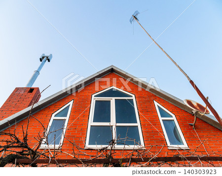 attic of village house with chimney and antenna attic of village house with chimney and antenna 140303923
