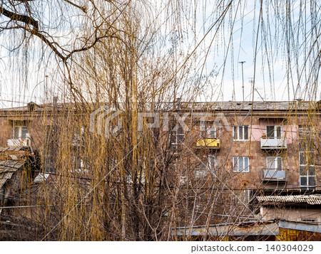 bare tree branches and old house in Vanadzor city bare tree branches and old house in Vanadzor city 140304029